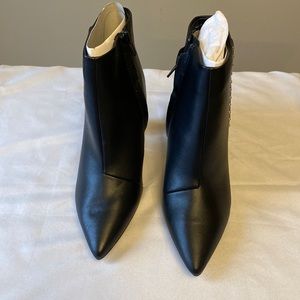 Black bootie with side zip.
